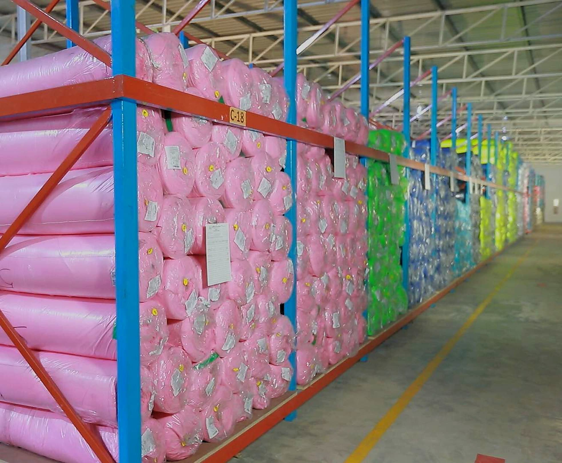 Racked rolls of fabric in the fabric store