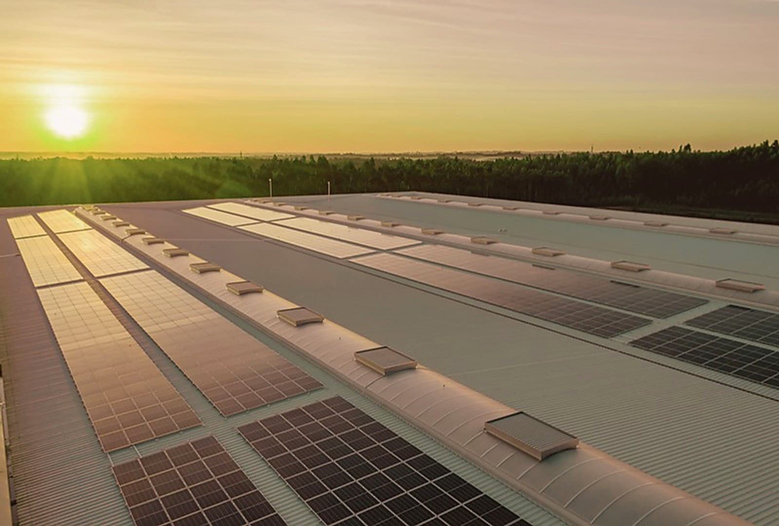 Rooftop solar array at sunset